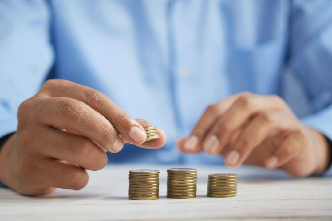 Stacking coins to show small monthly savings for the Atal Pension Yojana