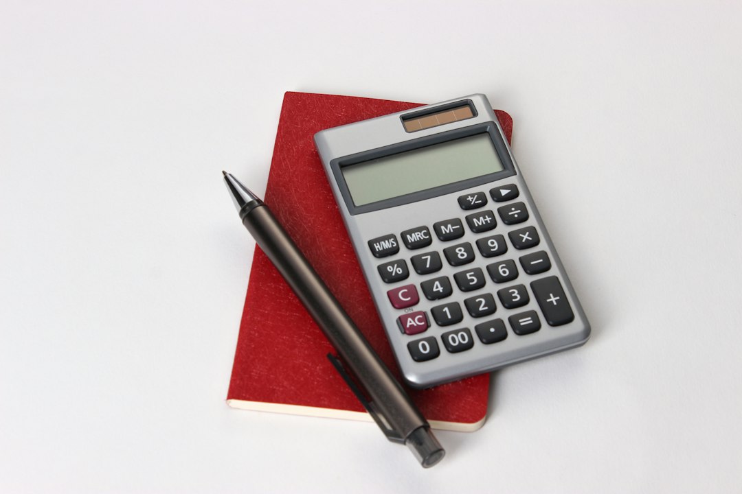 Calculators and books used to plan pension contributions