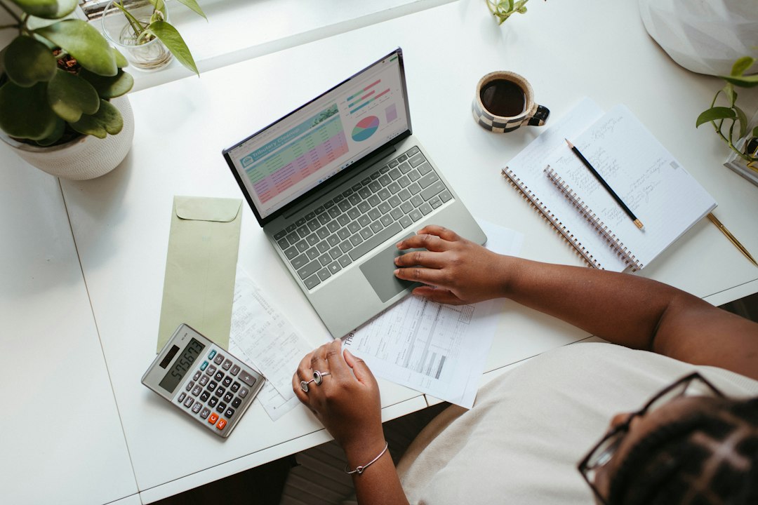 A person planning retirement savings on a laptop