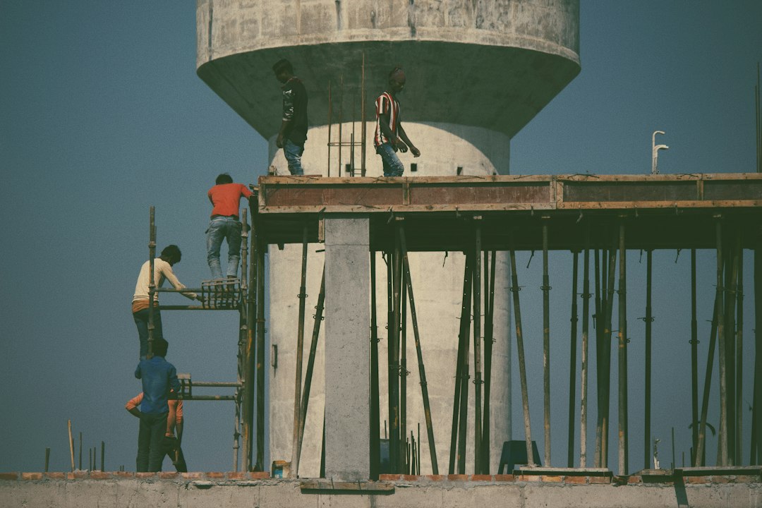 Workers constructing a house in India under the Pradhan Mantri Awas Yojana