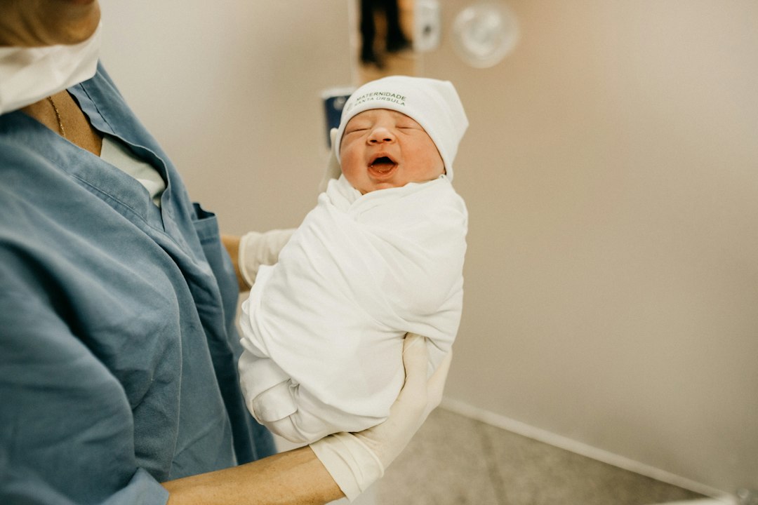 A woman carrying her baby